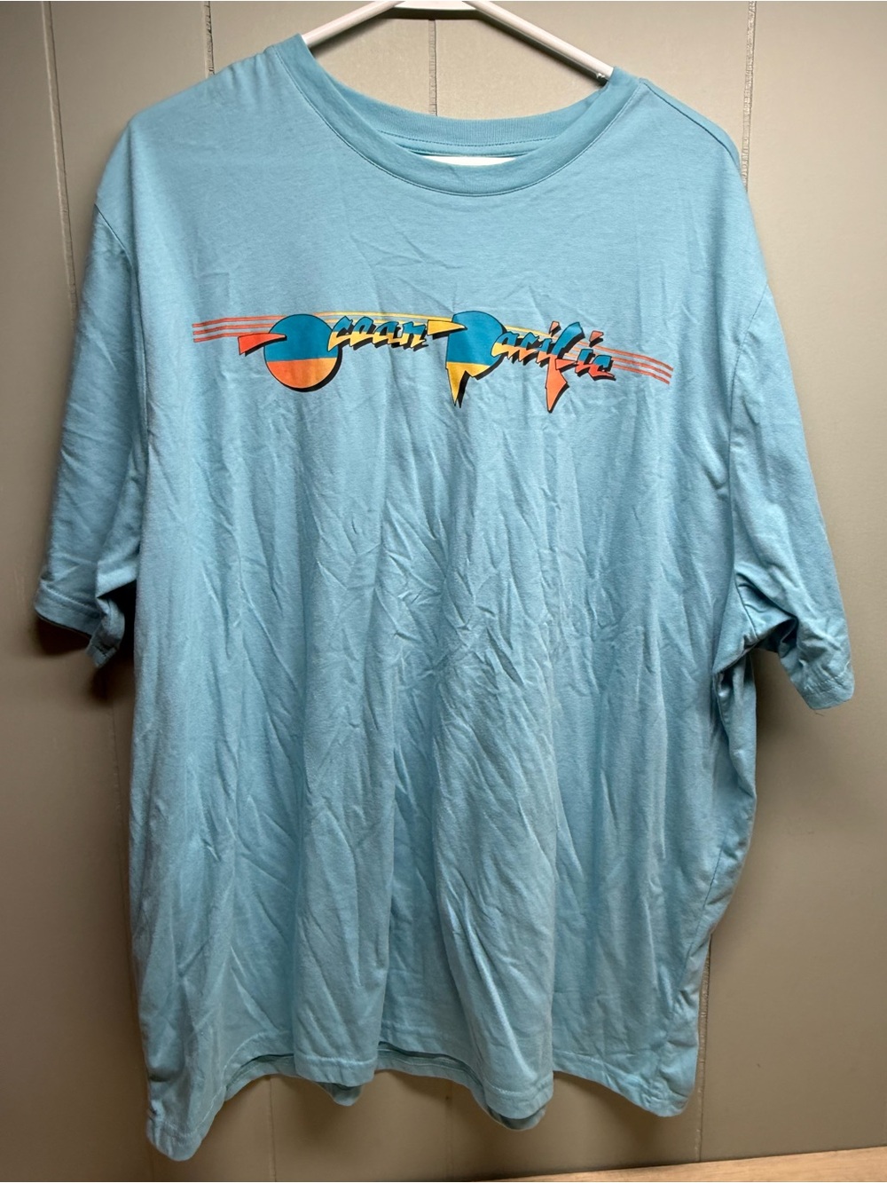 OP Light Blue Short Sleeve Graphic Tee with Retro Multicolor Print